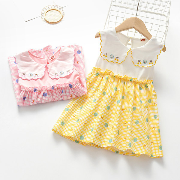 Dječja haljina s ovalnim izrezom i vezom