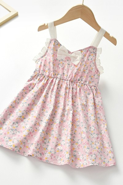 Dječja haljina sa cvjetnim motivima i trakom