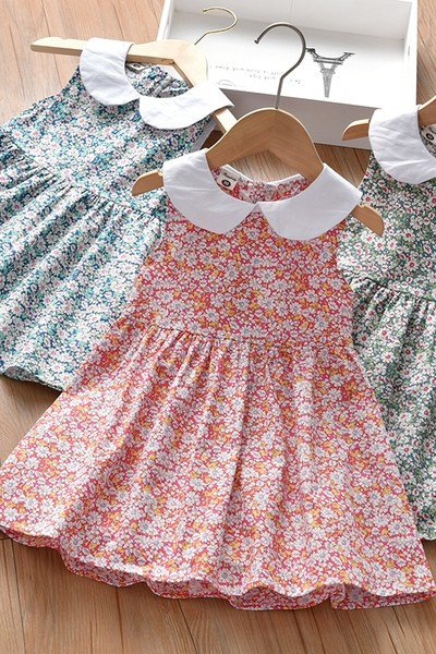 Moderna haljina s ovalnim izrezom i gumbima za djevojčice