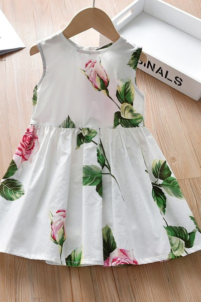 Moderna dječja haljina s okruglim izrezom bijele boje