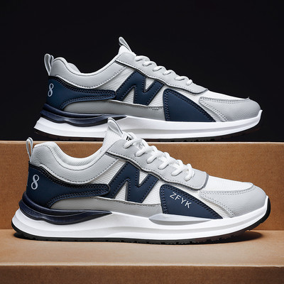 Kahes värvitoonis ja lameda tallaga meeste tossud