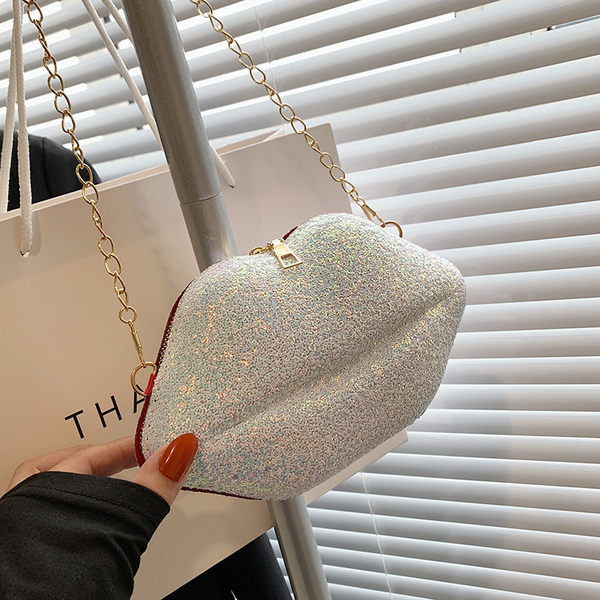 Лъскава дамска чанта с ципове