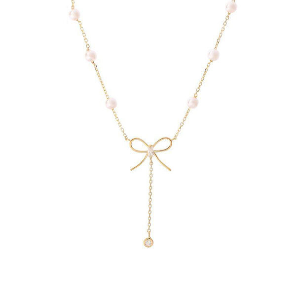 Χρυσό κολιέ με πέρλες και κορδέλα