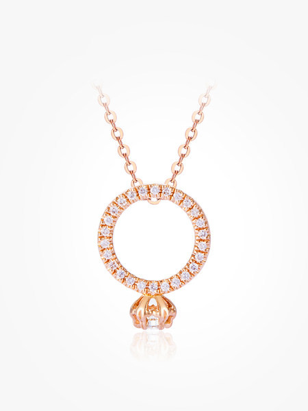 Zlatna ženska ogrlica sa kamenčićima i privjeskom