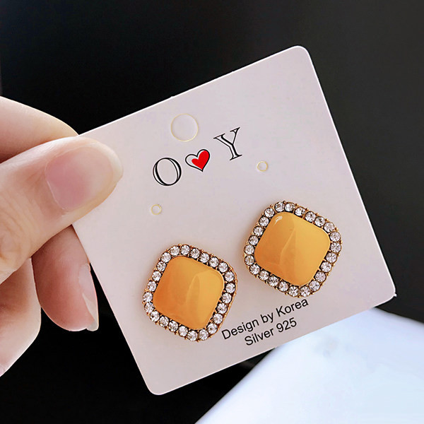 Ženske naušnice žute boje sa kamenčićima