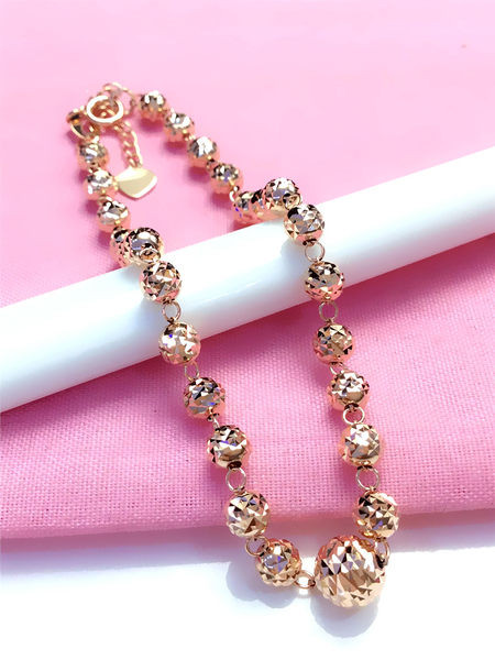 Kuldne naiste käevõru reljeefsete helmestega