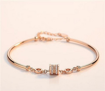 Zelta rokassprādze ar akmeņiem