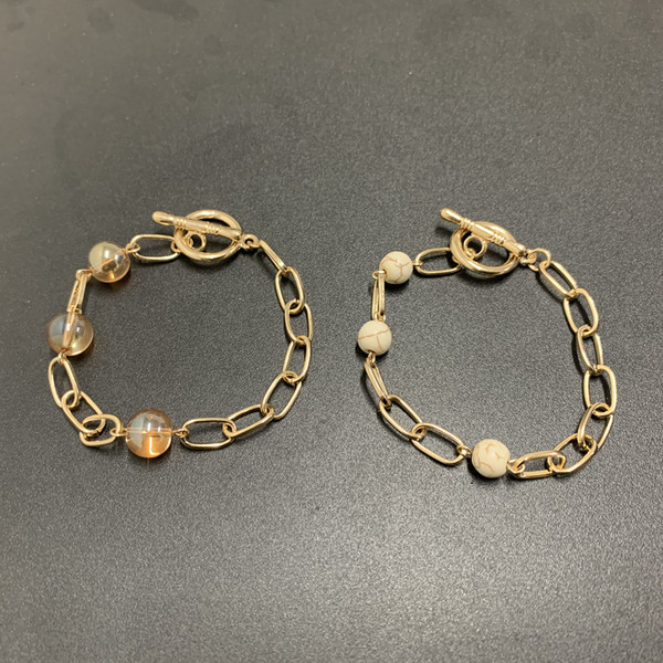 Μοντέρνο γυναικείο βραχιόλι με πέτρες-χρυσό χρώμα