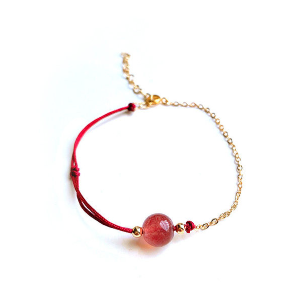 Ženska tekstilna narukvica s perlama u boji