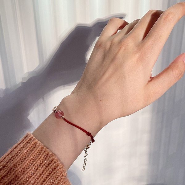 Ženska tekstilna narukvica s perlama u boji