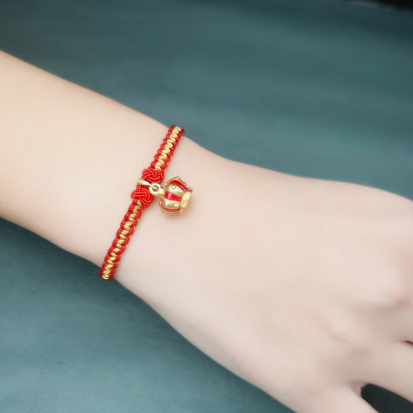 Ženska pletena narukvica s perlama