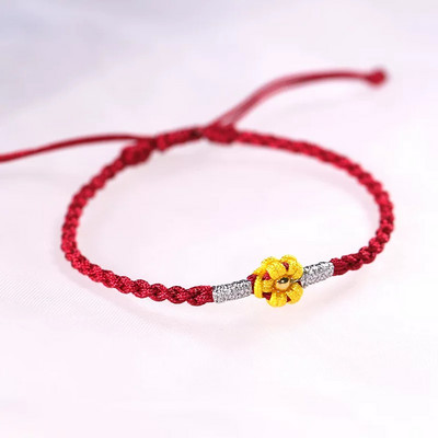 Ženska tekstilna narukvica sa cvijetom