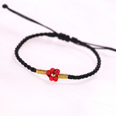 Ženska tekstilna narukvica sa cvijetom