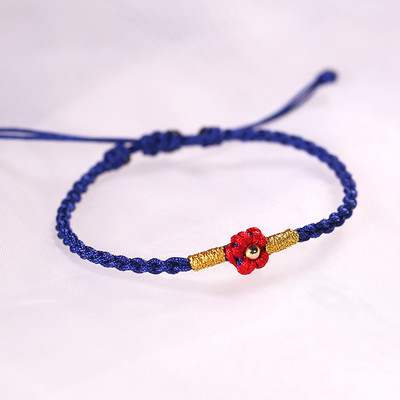 Ženska tekstilna narukvica sa cvijetom