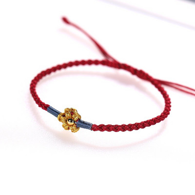 Ženska tekstilna narukvica sa cvijetom