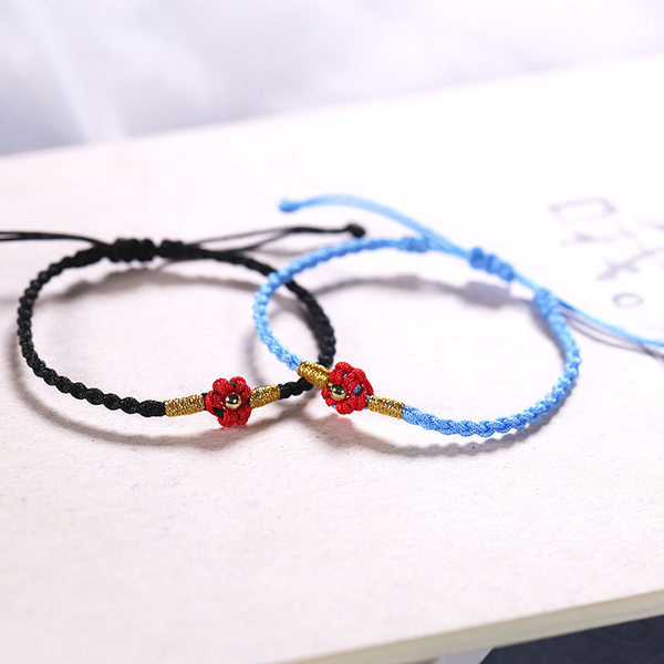 Ženska tekstilna narukvica sa cvijetom