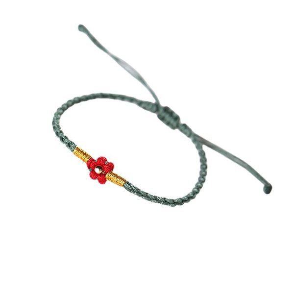 Ženska tekstilna narukvica sa cvijetom