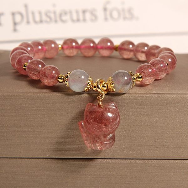 Ženska narukvica s perlama u boji i privjeskom