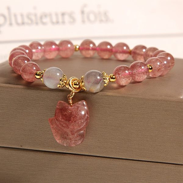 Ženska narukvica s perlama u boji i privjeskom