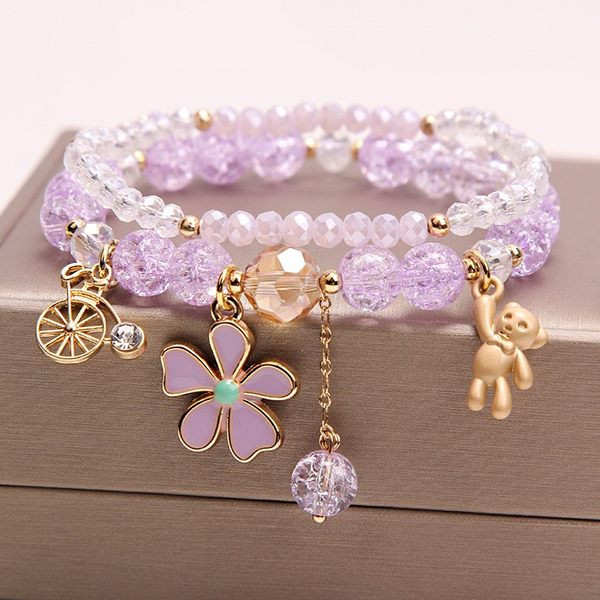 Värviline kivide ja ripatsidega käevõru