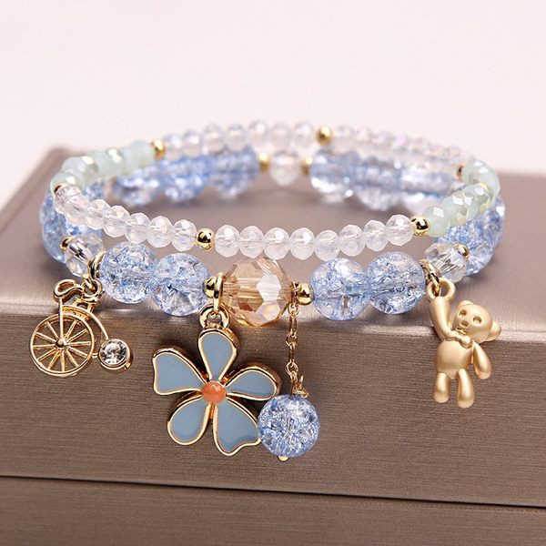 Värviline kivide ja ripatsidega käevõru