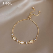 Χρυσό γυναικείο βραχιόλι με πέρλες και πέτρες