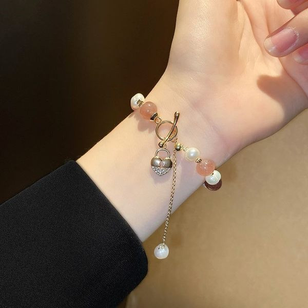 Γυναικείο βραχιόλι με πέρλες και μενταγιόν καρδιά