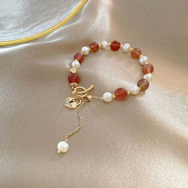 Γυναικείο βραχιόλι με πέρλες και μενταγιόν καρδιά