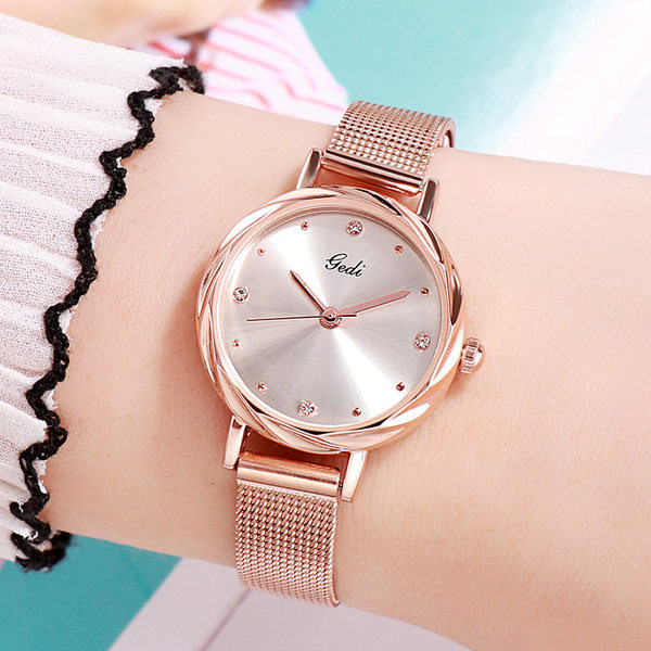 Ženski elegantni sat s brojčanikom u boji i ukrasnim kamenčićima