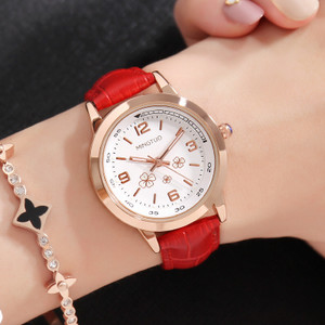 Naiste helendav käekell kunstnahast rihmaga