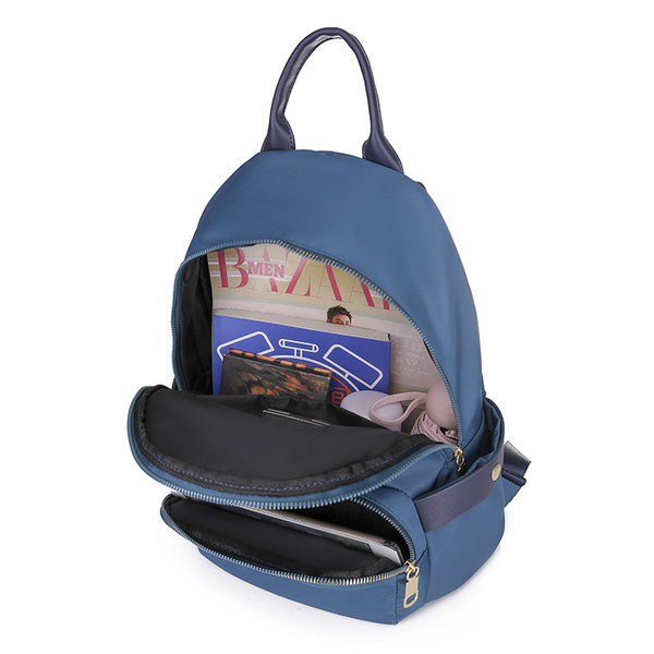 Naiste tekstiilist seljakott lukuga ja mitme lahtriga