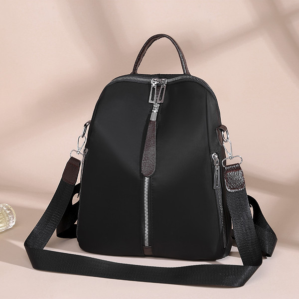 Ženski ruksak s prednjim patentnim zatvaračem i tekstilnom ručkom