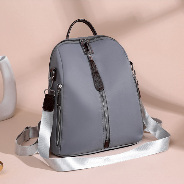 Ženski ruksak s prednjim patentnim zatvaračem i tekstilnom ručkom