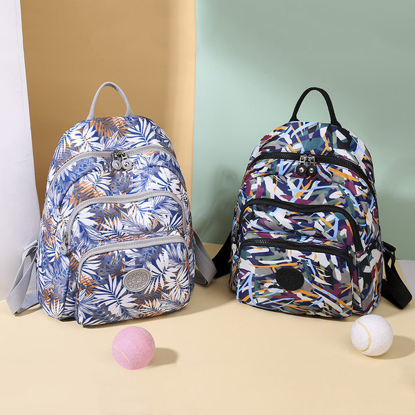 Ženski tekstilni ruksak s prednjim džepom - više boja