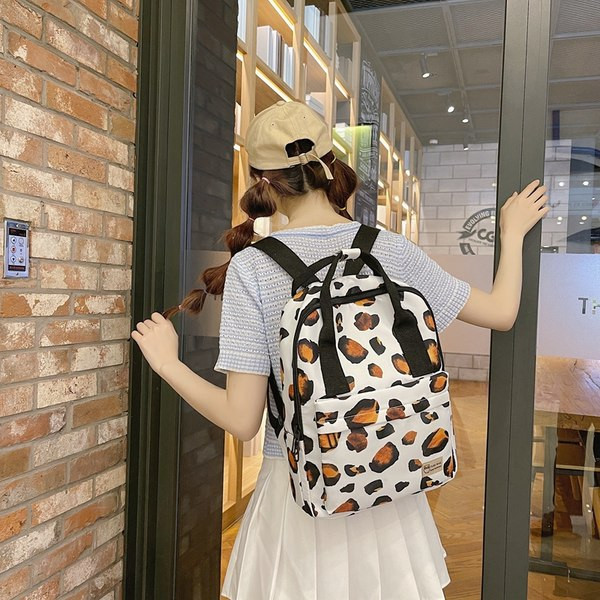 Ženski tekstilni ruksak s aplikacijom i amblemom