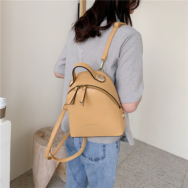 Naiste mini-nahast seljakott kirja ja tõmblukuga