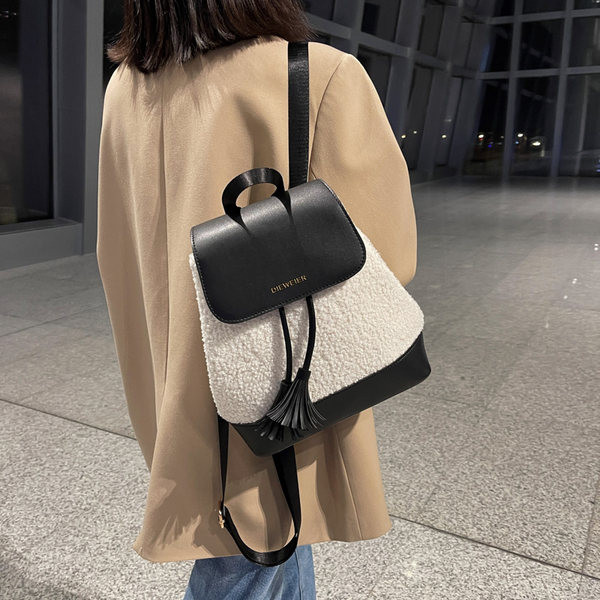 Tekstiilist ja ökonahast naiste seljakott kirjaga