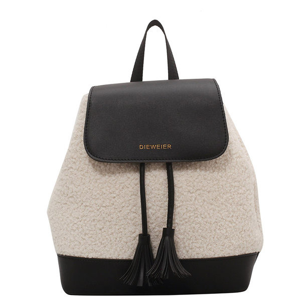 Tekstiilist ja ökonahast naiste seljakott kirjaga