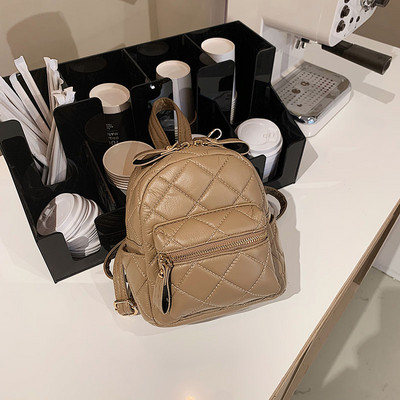 Väike tepitud efektiga naiste seljakott