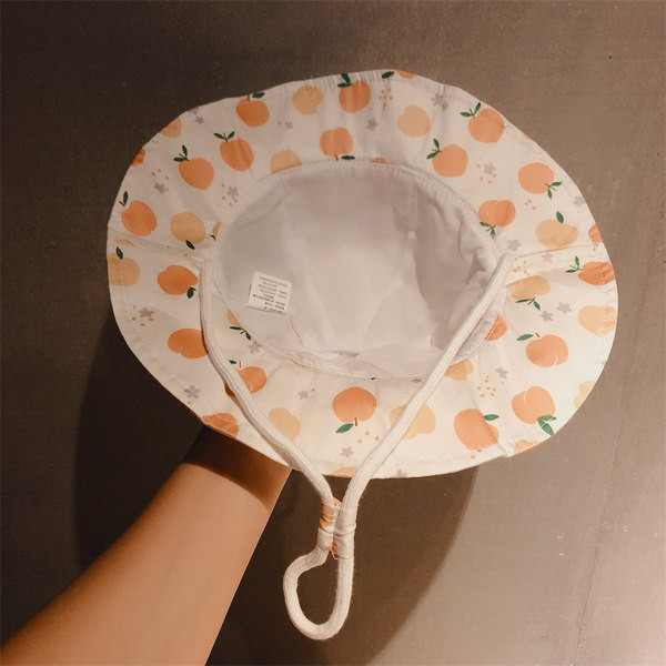 Laste tekstiilist müts võrkosaga