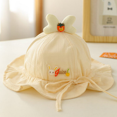 Beebi tekstiilist müts tikandi ja lipsudega