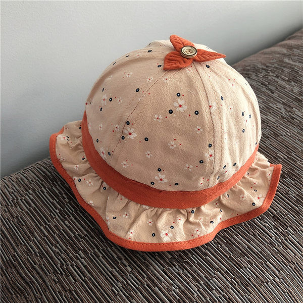 Beebi tekstiilist lokkidega müts