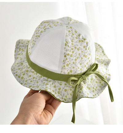 Lillemotiivide ja paelaga võrkkangast lastemüts