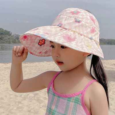 Laia äärega tekstiilist lastemüts