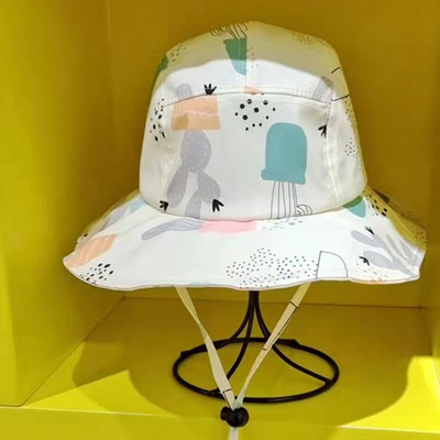 Kevad-suvine värvilise mustri ja lipsudega müts