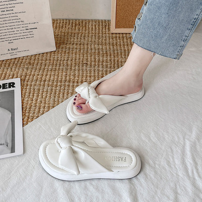 Γυναικείες παντόφλες ανάμεσα στα δάχτυλα από οικολογικό δέρμα με κορδέλα