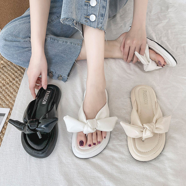 Γυναικείες παντόφλες ανάμεσα στα δάχτυλα από οικολογικό δέρμα με κορδέλα