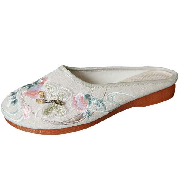 Zaobljene tekstilne papuče s vezom u boji