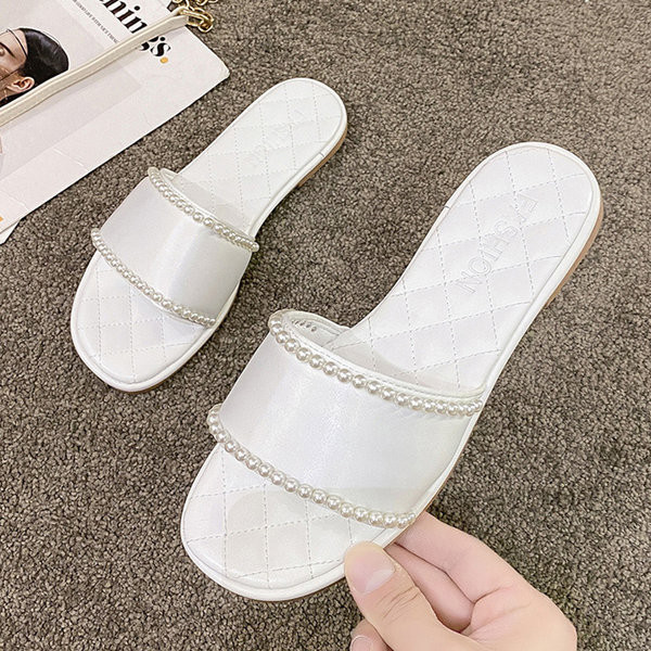 Ženske papuče s ravnim potplatom i bisernim ukrasom