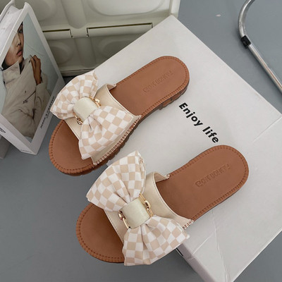 Ženske papuče s ravnim potplatom, trakom i metalnim lancem